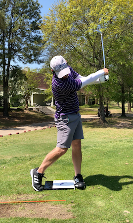 Golfer Geek mid follow-through with DownUnder Board